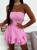 Rosa kurzer Musselin-Jumpsuit mit Korsagen-Oberteil und Skort mit Volants