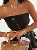 Kurzer schwarzer Musselin-Jumpsuit mit Korsagen-Oberteil und Skort mit Volants