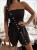 Kurzer schwarzer Damen-Playsuit für den Sommer, trägerlos mit gerafftem Korsett-Oberteil, lockeren Shorts mit Taschen und Bindegürtel