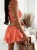 Sommer-Overall aus Muselin – apricotfarbener Skort-Jumpsuit mit Rüschen