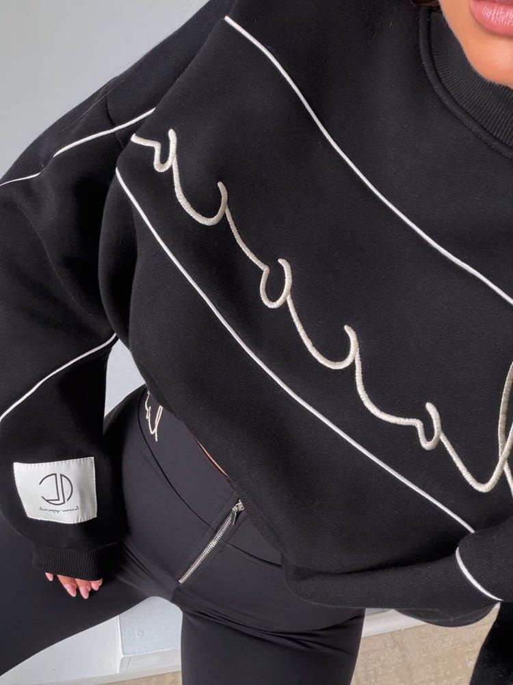 sweatshirt-la-coca-aura-schwarz