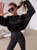 sweatshirt-la-coca-aura-schwarz