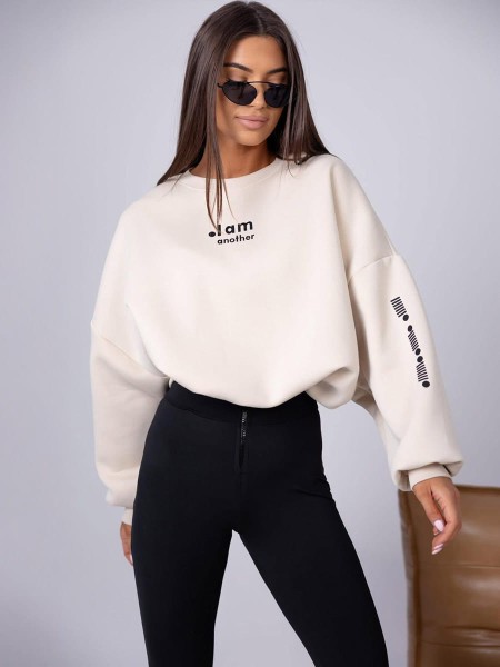 damski komplet beżowa bluza oversize i czarne legginsy z wysokim stanem oraz zamkiem z przodu