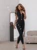 Czarne legginsy push up z wysokim stanem z marszczeniem i złotym zamkiem z tyłu oraz logo producenta Loox Fashion na przodzie