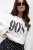 Set: Weißer Hoodie mit „90s Babe“-Schriftzug und schwarzer Ballonrock mit weißen Punkten