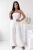 Weißer Musselin-Jumpsuit mit langer Hose