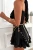 Kurzer schwarzer Korsagen-Sommer-Jumpsuit im Skort-Design