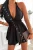 Schwarzer Neckholder-Playsuit mit tiefem Ausschnitt und rückenfreiem Design