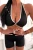 Schwarzes Sport-Set mit tief ausgeschnittenem Top und formender Radlerhose